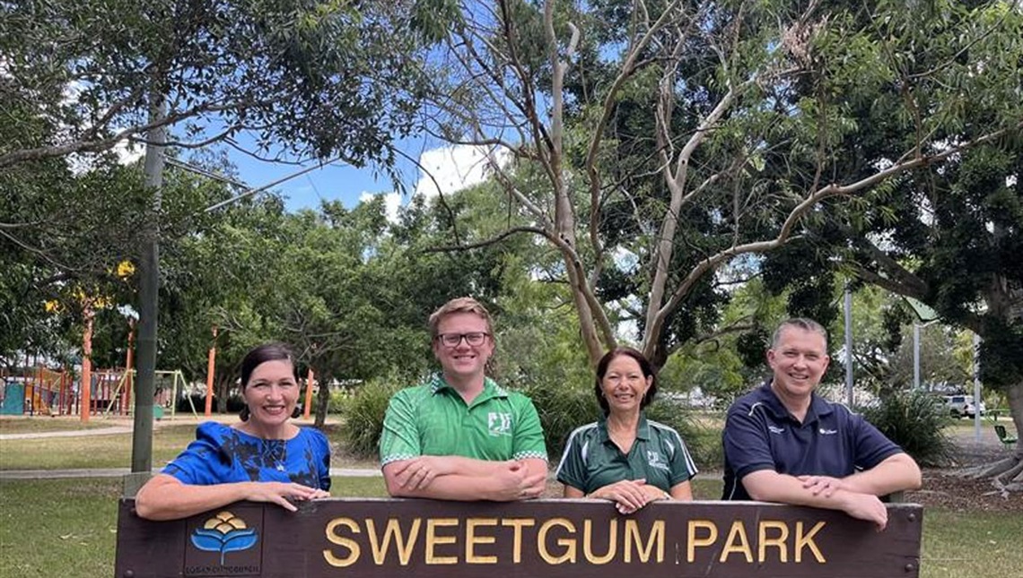 State Member for Algester Leeanne Enoch, Forestdale group member Brad Yates, Kerri from the Hillcrest group and Cr Tim Frazer standing behind the Sweetgum park sign