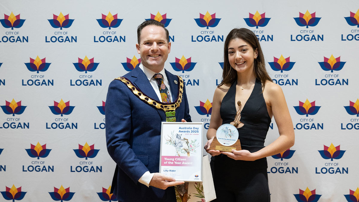 City of Logan Mayor Jon Raven presents Lilly Rider with her 2025 Young Citizen of the Year Award on Australia Day.