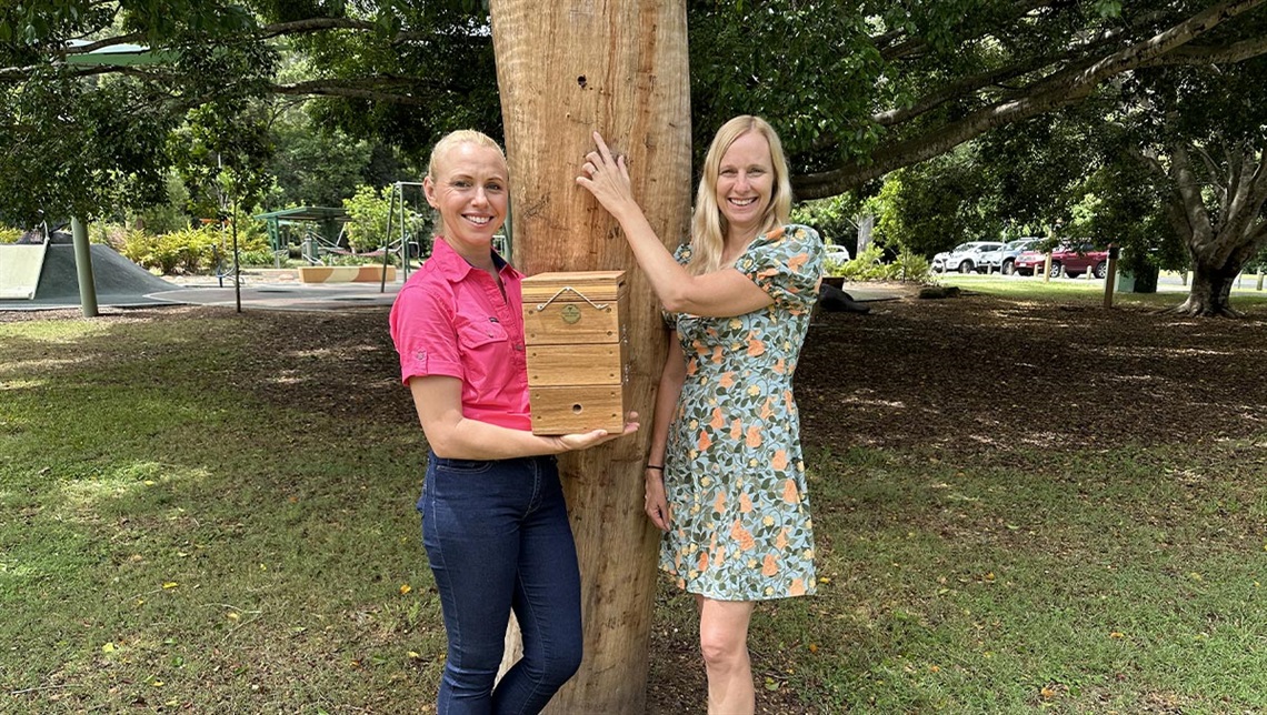Councillor Stemp pointing to the new native been hive 