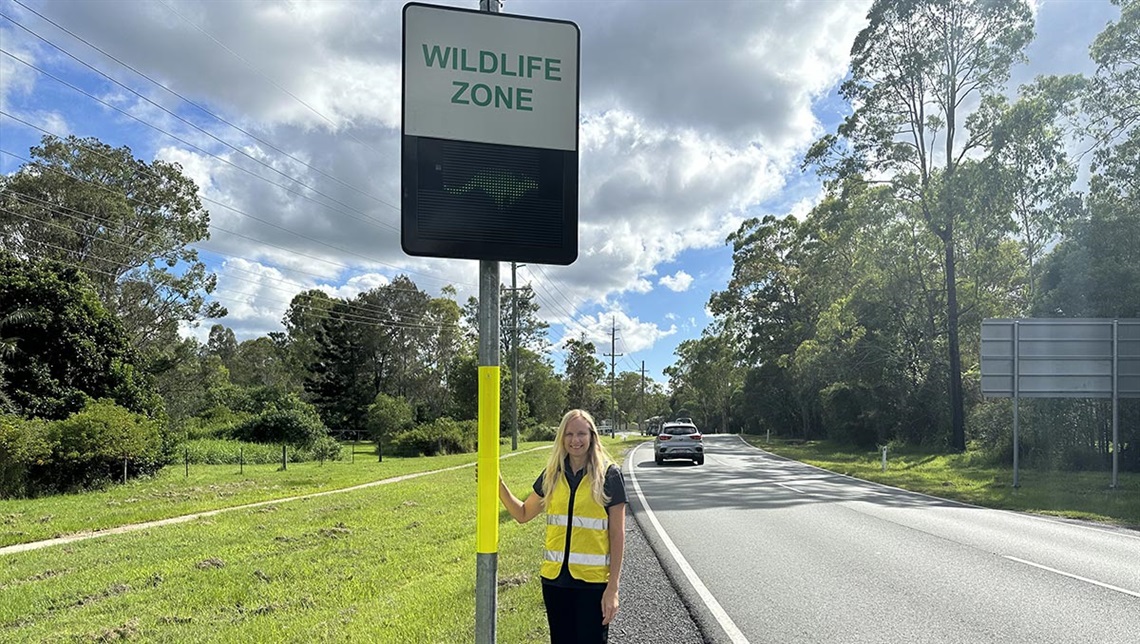 Councillor Stemp standing next to a new Wildlife Zone sign 