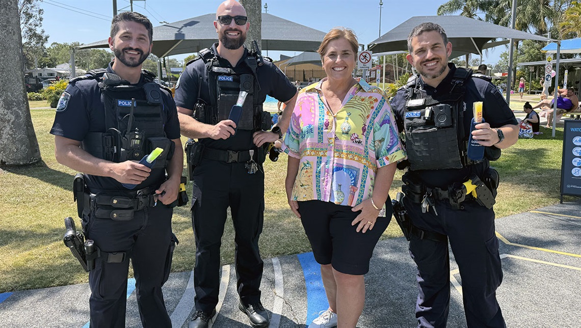 Cr Karen Murphy treating officers from Eagleby Neighbourhood Police Beat with refreshing ice blocks at the recent Eagleby pool party