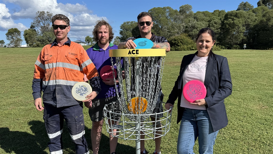 Cr Willcocks at the Logan West Parklands disc golf course with Rhys, Alex and Bendle.