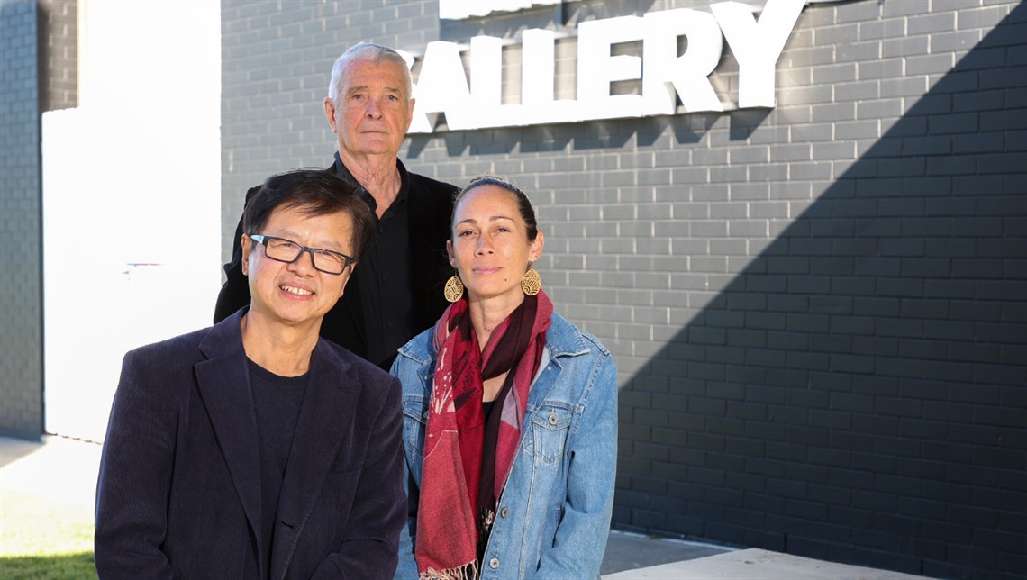 From left, Jun Chen, Richard Blundell (standing) and Jessica Skeen-McKinnon (Muralappi) at the Logan Art Gallery ahead of 30th anniversary events.