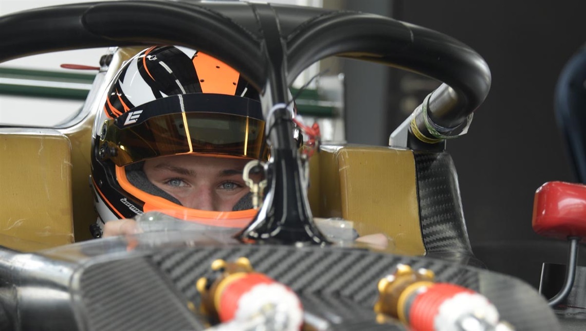 Lincoln Evans wearing a helmet in a ferrari