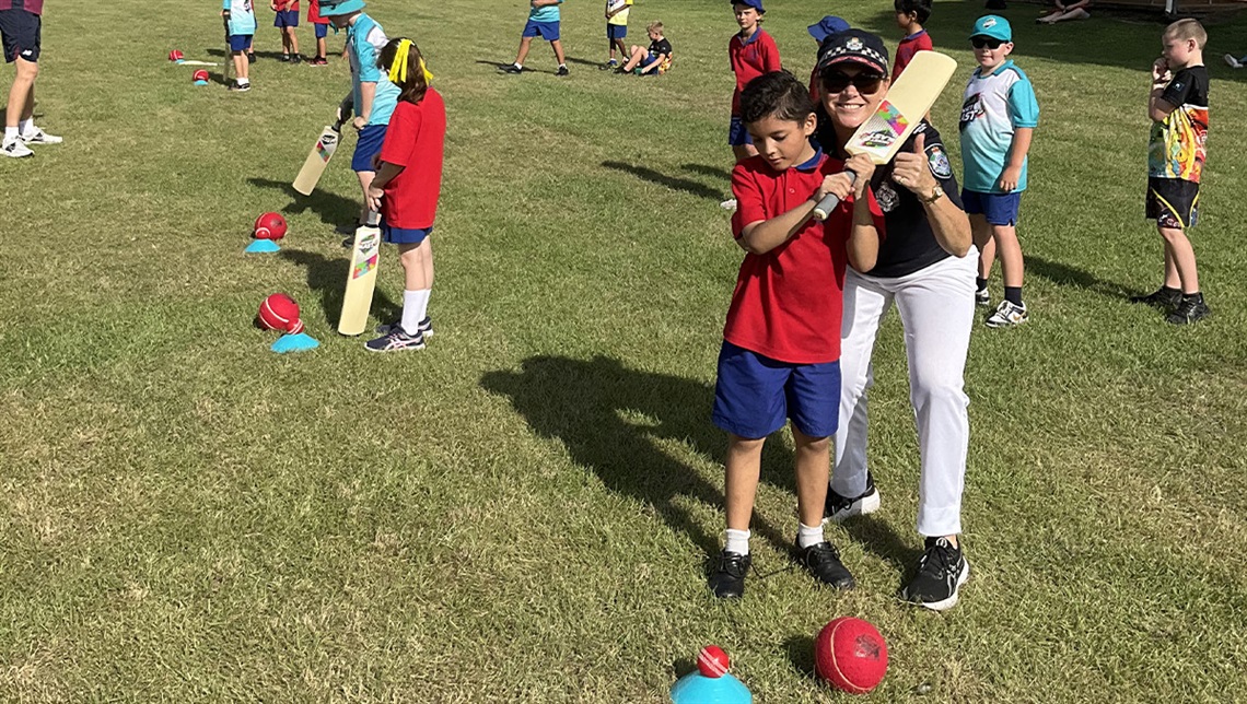 Acting Sergeant Joanne McKinnon with kids at Waterford West State School.