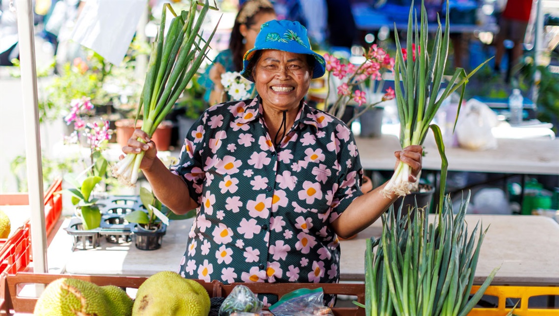 Kingston’s Nom Kebngoen, a Global Food Markets stallholder with fruits, vegetables and an incredible story to tell. Photo: Josh Woning