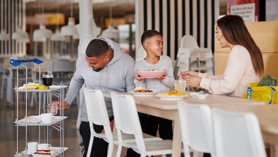A family sitting at a table eating lunch