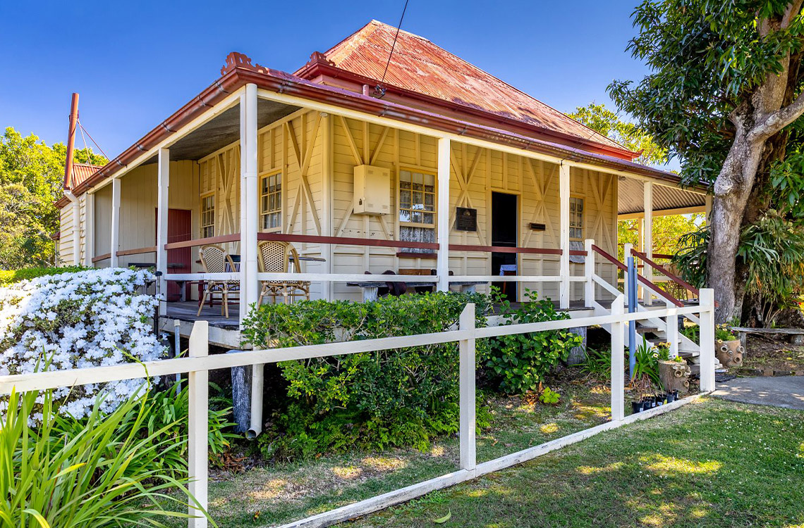 Mayes Cottage museum house and verandah leading in the garden