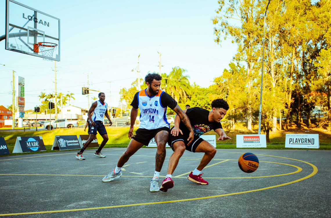 Men on a basketball court in Logan playing sport