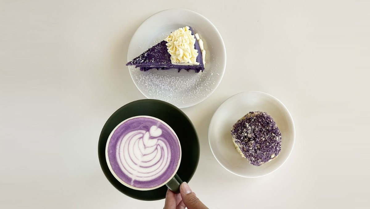 A purple latte, and two purple cakes in bowls 