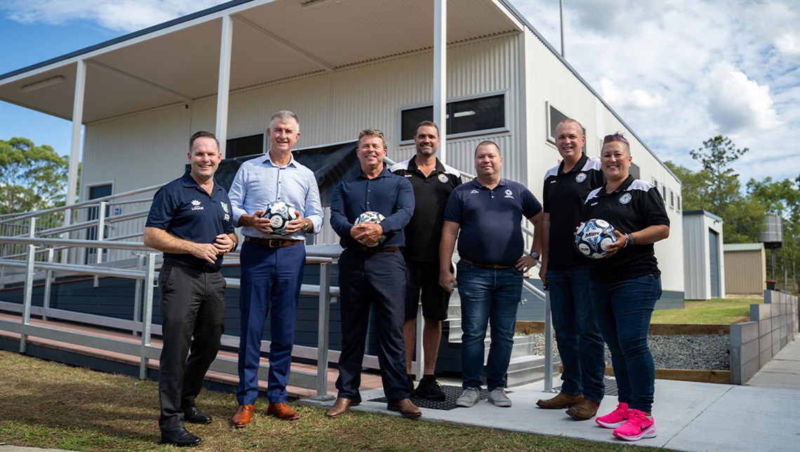 From left, Mayor Jon Raven, Minister for Sport Tim Mander and Deputy Mayor Scott Bannan with representatives from Jimboomba United Football Club and Football Queensland