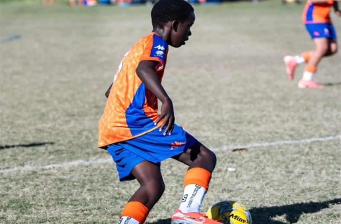 Article_Confluenced onside african football program.jpg