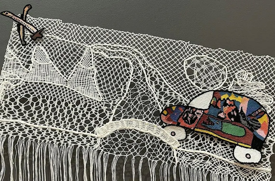 artwork of macrame landscape with colourful car